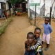 Three young boys look out from their shantytown in Soweto, South Africa, south of Johannesburg.